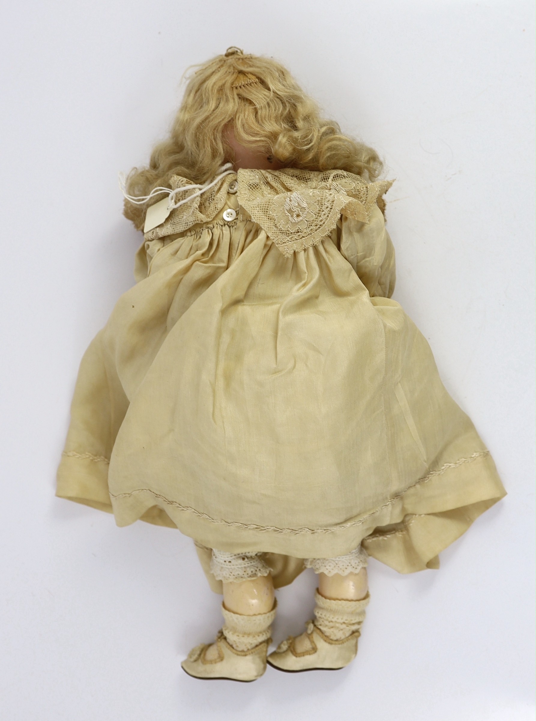 A Heinrich Handwerck bisque doll, German, circa 1900, 18in. and 23in. resp.